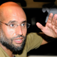 Saif Al-Islam, son of Libyan leader Muammar Gaddafi, gestures as he talks to reporters in Tripoli August 23, 2011.